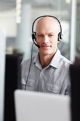 Image showing Call center, man and portrait in office communication, technical support, information technology and computer. Face of IT agent, web consultant or person with tech job for client or customer service