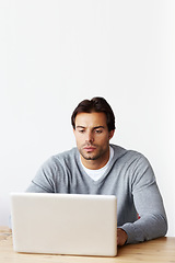 Image showing Laptop, research and business man isolated on white background for startup, career planning or web design ideas. Creative, focus and serious person or online user on computer at desk in studio mockup