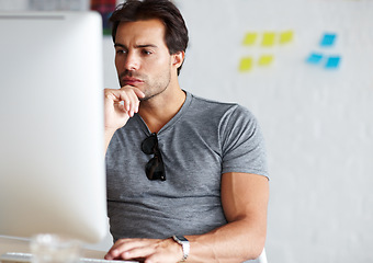 Image showing Thinking, ideas and business man on computer for online project, website design and brainstorming or brand solution. Creative person or serious designer on his pc planning startup or problem solving