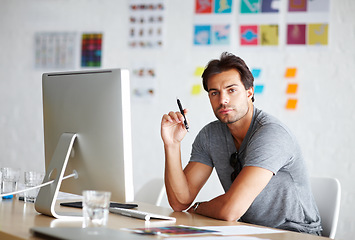 Image showing Computer, portrait and pen for man planning, ideas and creativity for online career, graphic design and website. Creative, face and serious person on desktop pc, startup business and office workplace