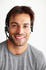 Image showing Portrait, call center and consultant man isolated on white background in virtual communication or technical support. Face of business agent or happy telecom person for telemarketing in studio mockup