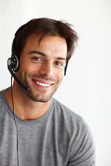 Image showing Portrait, call center and happy man isolated on a white background in virtual communication or technical support. Face of business agent, consultant or sales person for telemarketing career in studio