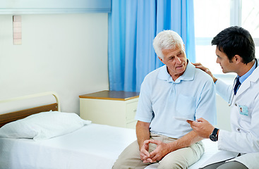 Image showing Doctor, senior man patient and talking with paperwork, results and news for health in retirement at clinic. Men, medic and consultation for wellness, healthcare and discussion in hospital mock up