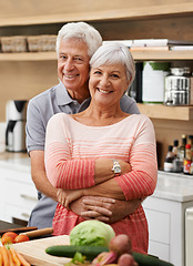 Image showing Cooking, love and portrait of old couple in kitchen for salad, health or nutrition. Happy, smile and retirement with senior man hugging woman and cutting vegetables at home for food, dinner or recipe