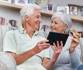 Image showing Senior couple, tablet and credit card for online shopping on living room sofa together at home. Happy elderly man and woman smiling on technology for ecommerce, banking app or payment on lounge couch