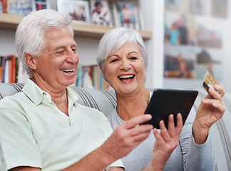 Image showing Excited senior couple, tablet and credit card for online shopping on living room sofa together at home. Happy elderly man and woman smiling on technology in ecommerce, sale or payment on lounge couch