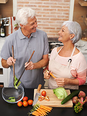 Image showing Cooking, health and smile with old couple in kitchen for salad, love and nutrition. Happy, help and retirement with senior man and woman cutting vegetables at home for food, dinner and recipe