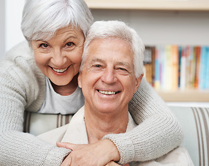 Image showing Senior, happy couple and portrait with hug for love, romance or embrace in relationship or marriage at home. Face of elderly woman hugging man with smile for care or bonding together in retirement