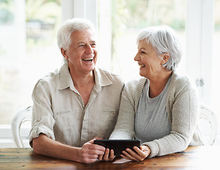 Image showing Tablet, senior couple and laughing in home on social media, funny news and online meme. Happy old man, woman and relax with digital technology, subscription and streaming comedy on network connection