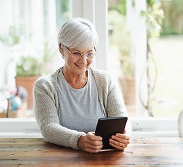 Image showing Tablet, senior woman and online in house with social media, reading news app and relax with ebook. Retirement, happy old lady and digital technology for subscription, streaming and network connection