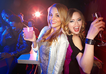 Image showing Party, friends and alcohol drinks at a nightclub while dancing, happy and excited to celebrate birthday, new years or happy hour together. Portrait of women with cocktails for a celebration at a club