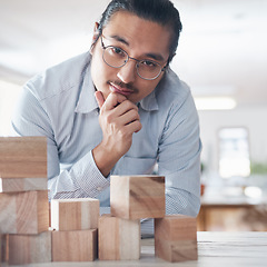 Image showing Building blocks, business man with plan and vision challenge for design innovation and startup growth. Engineering, architecture and ides, Asian designer with wood block for problem solving games.