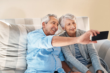 Image showing Senior couple, selfie and smile on sofa with happiness on social media, blog or post on internet. Elderly man, woman and photography for profile picture on app, web or happy together on couch in home