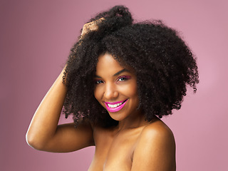 Image showing Face, hair care and happy black woman with afro in studio isolated on pink background. Hairstyle portrait, makeup cosmetics and African female model with salon treatment for beauty, growth or healthy