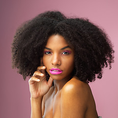 Image showing Face, hair care and serious black woman with makeup in studio isolated on a pink background for skincare. Hairstyle portrait, cosmetics and African female model with salon treatment for afro beauty.