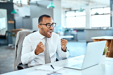 Image showing Business man, winning and yes on computer success, news or bonus in celebration, cheers and wow in office. Excited, fist and winner, employee or person celebrate on laptop promotion, sales or results