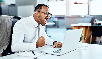 Image showing Business man, laptop and trading, winning in investment with celebration and cheers in office with excited employee. Male trader at desk, pc and bonus with investing success, winner and achievement