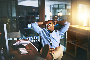 Image showing Night, business and man relax, employee and creative with startup success, company development and computer. Male person, entrepreneur or consultant working late, chilling or technology in the office