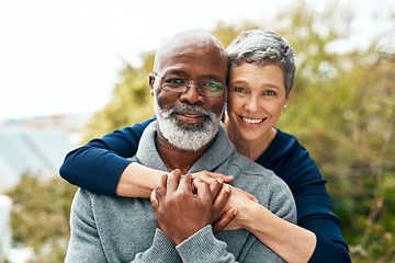 Image showing Portrait, hug and senior couple with love, interracial and marriage with happiness, bonding and romance. Face, partners outside or mature woman with elderly black man, embrace and romantic with smile