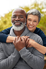 Image showing Portrait, park or senior couple with hug, interracial or romantic with bonding, marriage or relationship. Face, mature black man or elderly woman embrace, retirement or partners with romance or love