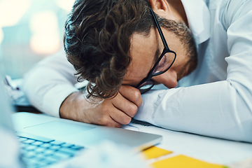 Image showing Sleeping, man and tired in office with burnout, fatigue and overworked business employee on desk with glasses, paper and laptop. Businessman, lawyer and exhausted sleep in company workplace