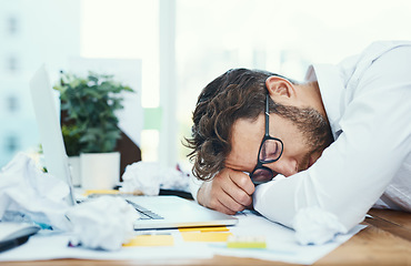 Image showing Tired, man and sleeping on office desk with burnout, fatigue and overworked business employee with glasses, documents and laptop. Businessman, lawyer and exhausted sleep in company workplace