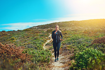 Image showing Woman running through field, fitness outdoor with cardio and training for marathon with young athlete and sports. Female runner in nature, hiking trail and run for exercise, healthy and active person