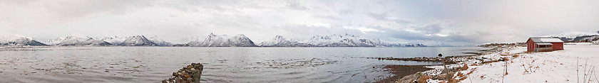 Image showing Fjord with red house and snow during the winter