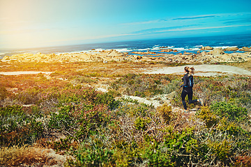 Image showing Woman run, beach and fitness outdoor with cardio and training for marathon with young athlete and sports. Female runner in nature, ocean and running for exercise with healthy and active person