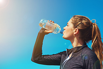 Image showing Woman drinking water, health and fitness with blue sky, athlete outdoor with hydration and mockup space. Sports, exercise and female person with h2o drink in bottle, workout and break from training