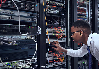 Image showing Black man, IT technician and server room for cyber security, data or network storage inspection. African male person or networking administrator checking system, cables or installation at datacenter