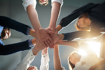 Image showing Hands together, support and business people in team with goals, solidarity and trust with professional community. Diversity, collaboration and corporate group in meeting in low angle and commitment