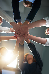 Image showing Hands together, solidarity and business people in team with low angle, support and trust with professional community. Diversity, collaboration and corporate group in meeting with goals and commitment