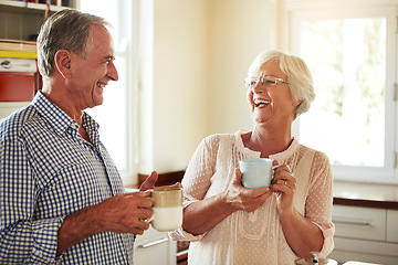 Image showing Funny, coffee or old couple laughing in kitchen at home bonding or enjoying quality time together. Happy retirement, morning or senior man talking, relaxing or drinking tea espresso with mature woman