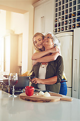 Image showing Hug, mom or happy woman cooking food for a healthy vegan diet together with love in family home. Smile, embrace or adult daughter hugging or helping senior mother in house kitchen for lunch or dinner