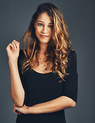 Image showing Portrait, face and fashion of woman in studio with natural beauty, hair care and aesthetic makeup on background. Beautiful female model with confidence, casual style and curly hairstyle on backdrop