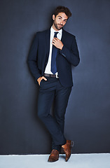 Image showing Portrait, fashion and a corporate business man in studio on a grey background mockup for executive style. Success, professional and a confident young male employee in a suit for formal mock up power