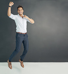 Image showing Portrait, mockup and man with business, happy and excited guy against a dark studio background. Face, male person and employee with happiness, winning and achievement with career and professional