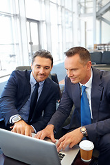 Image showing Laptop, negotiation meeting and businessman and client in company lobby for strategy, planning or feedback. Professional people, financial advisor or businessman talking to partner of investment plan