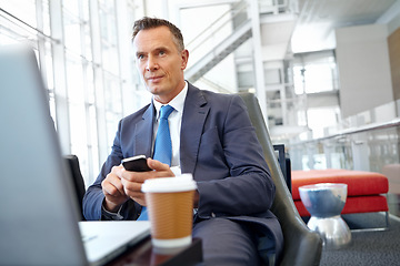 Image showing Thinking, corporate or business man with phone in office for communication, social networking or content blog review. Coffee, laptop or manager with smartphone for social media, search or mobile app