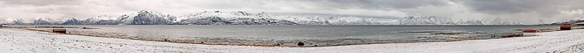 Image showing Panorama of Fjord with red houses and snow