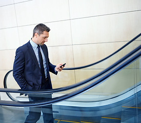 Image showing Chat, email and businessman with a phone for contact, internet and app. Executive, communication and corporate employee typing on a mobile for social media, work and online trading on an elevator