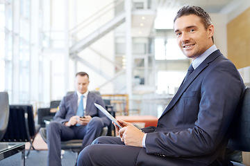 Image showing Portrait, corporate or business man with tablet for invest strategy, finance growth or financial review. Smile, airport or manager in lobby on sofa for travel, data analysis or economy data research