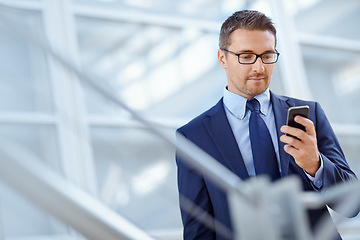 Image showing Networking, corporate or business man with phone for internet research, social media at hotel lobby before trip to an airport. Tech, online or ceo in on smartphone for travel blog review or app