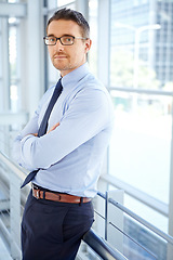 Image showing Business man, arms crossed and portrait in office building for pride, corporate confidence and assertive empowerment. Serious face, confident and mature CEO manager by window in executive company