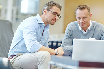 Image showing Meeting, planning and businessman or clients on laptop in company lobby for strategy, planning or feedback. Professional people, financial advisor or employee talking to partner of startup investment