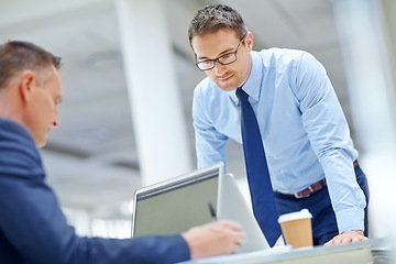 Image showing Office laptop, team and businessman reading portfolio review, stock market database or investment. Economy, research colleague and online trader work on finance exchange, crypto mining or NFT trading