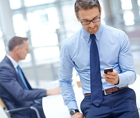 Image showing Business man, reading or phone in modern office for corporate email, research or company growth planning. Serious manager, CEO or executive worker on mobile technology for meeting schedule management