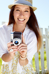 Image showing Woman portrait, photographer or vintage camera in holiday location, summer vacation or Germany sightseeing break. Smile, happy or travel blogger with photography equipment for tourist nature review