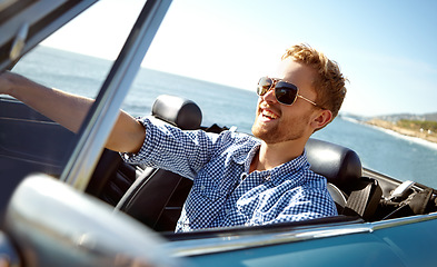 Image showing Car road trip, travel and laughing man on holiday adventure, transportation journey or fun summer vacation. Ocean sea, convertible automobile and happy driver driving on Australia countryside tour